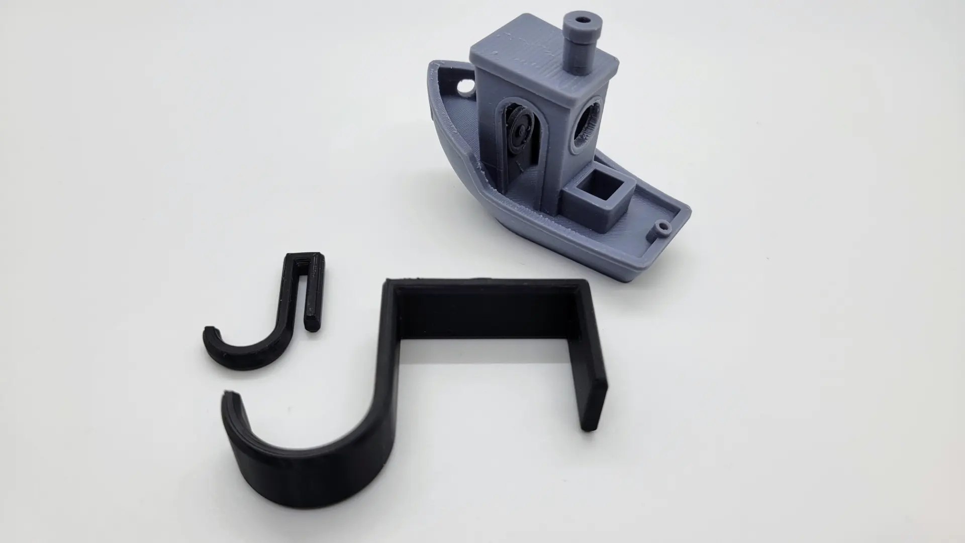 A render of a customizable hook that is square on one end and round on the other