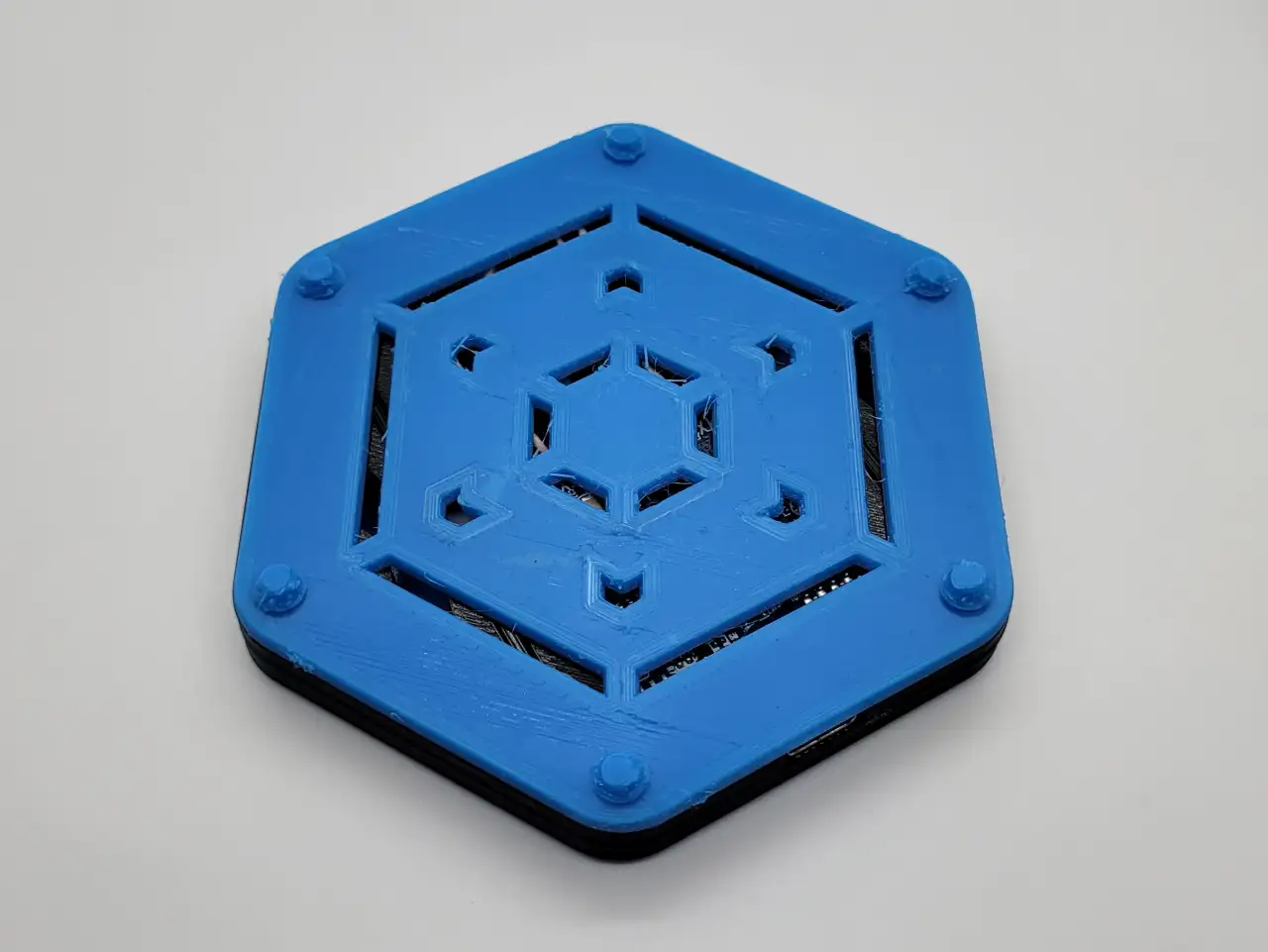 Feet being placed on the bottom cover of a wireless charging module