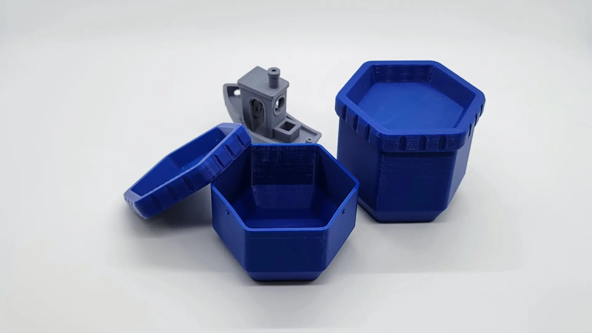 A render of a customizable parametric 3d printed stackable storage container shaped like a hexagon