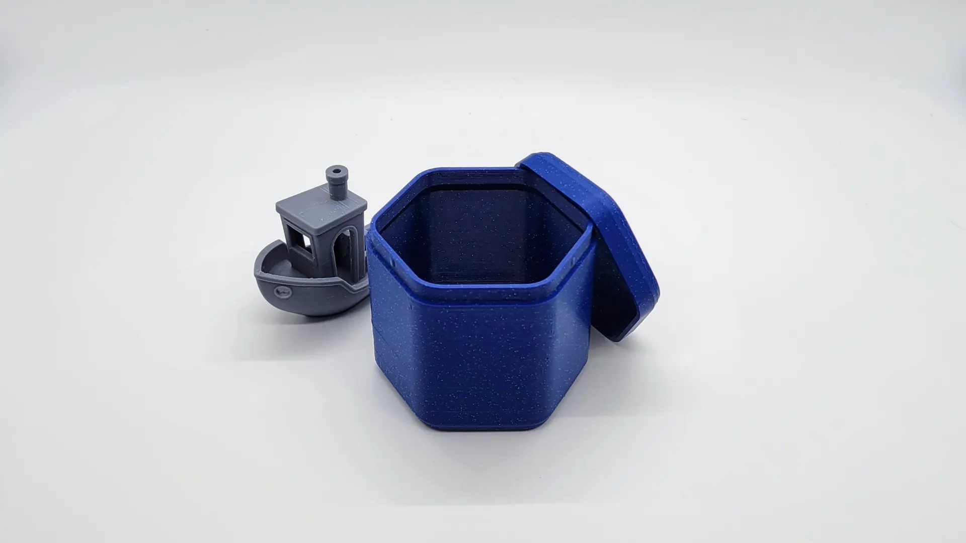 A render of a customizable parametric 3d printed stackable storage container with snap closure