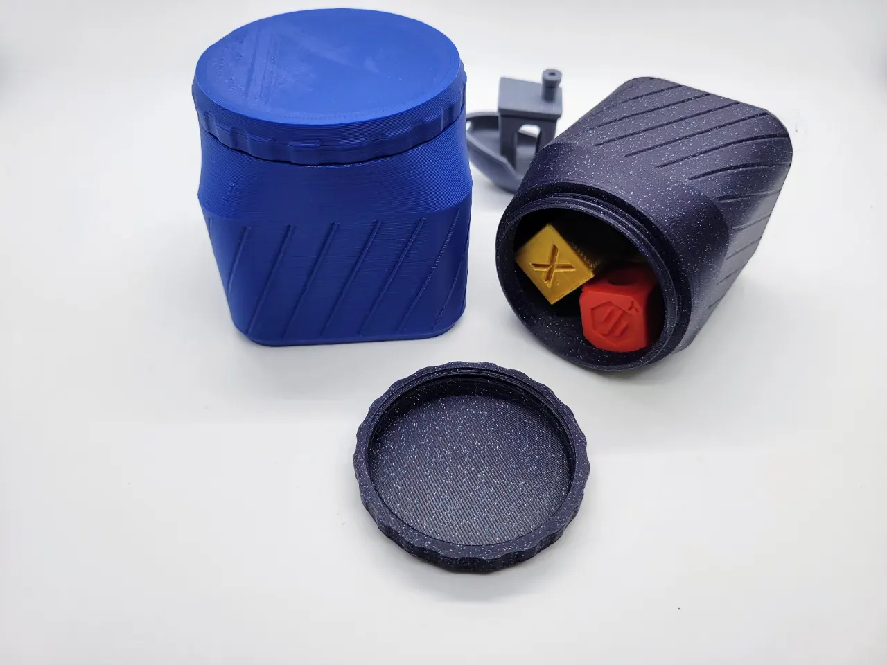 A photo of a 3d printed customizable magnetic base square shaped container featuring a screw on lid