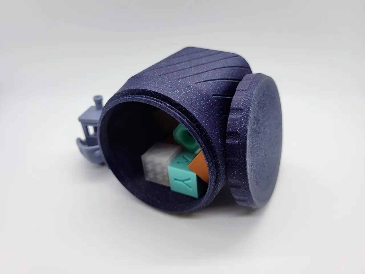 A photo of a 3d printed customizable magnetic base hexagon shaped container featuring a screw on lid